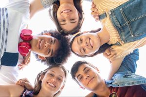 Group of happy children smiling down at camera